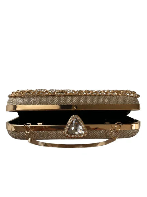 Gold evening clutch with crystal embellishments and a jeweled triangular clasp